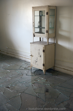antique medicine cabinet, floor of broken glass